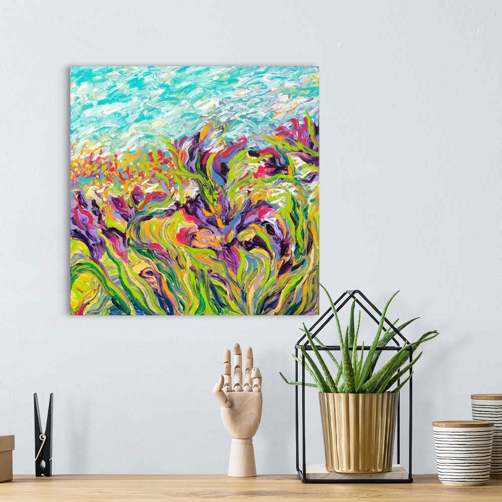 A bohemian room featuring Brightly colored contemporary artwork of a field of purple irises.