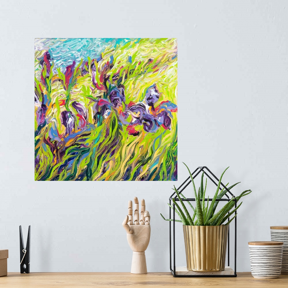 A bohemian room featuring Brightly colored contemporary artwork of a field of purple irises.