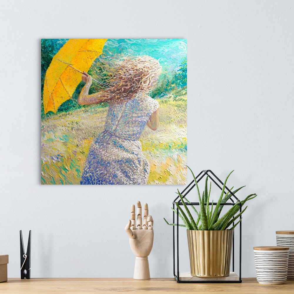 A bohemian room featuring Brightly colored contemporary artwork of a woman in a windy field.