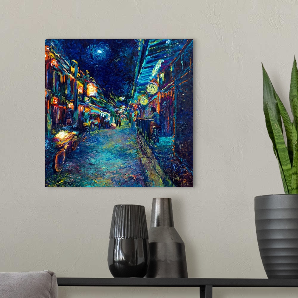 A modern room featuring Brightly colored contemporary artwork of an alley view street.