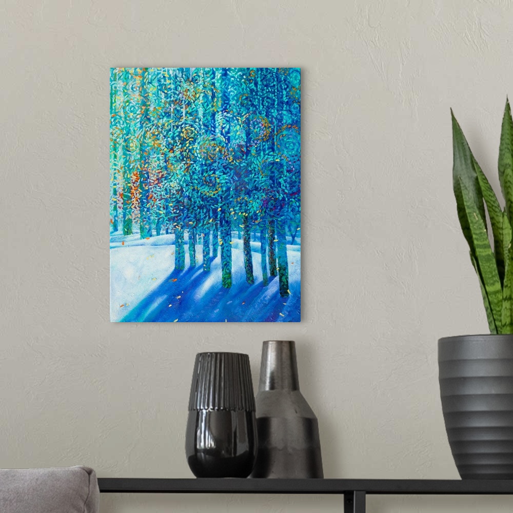 A modern room featuring Brightly colored contemporary artwork of blue trees in the snow.