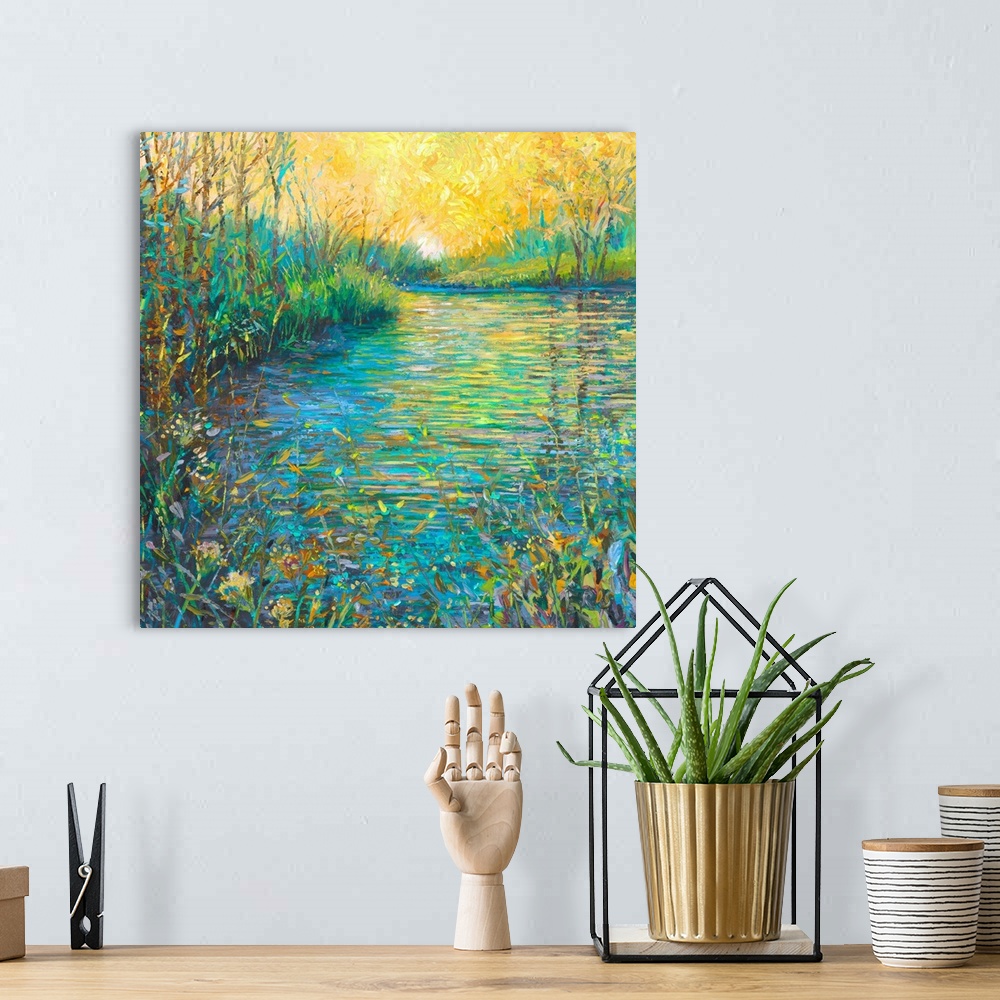 A bohemian room featuring Brightly colored contemporary artwork of a landscape with a lake and foliage.