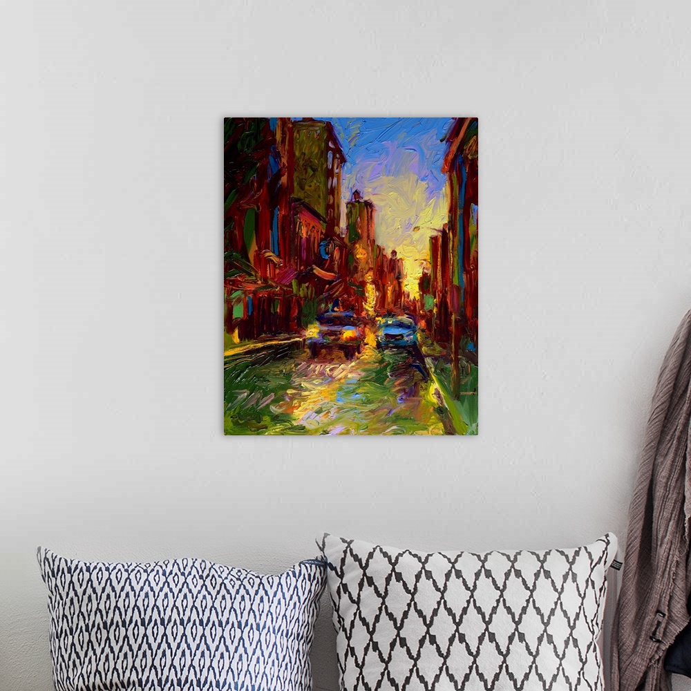 A bohemian room featuring Brightly colored contemporary artwork of a street view of cars passing by.