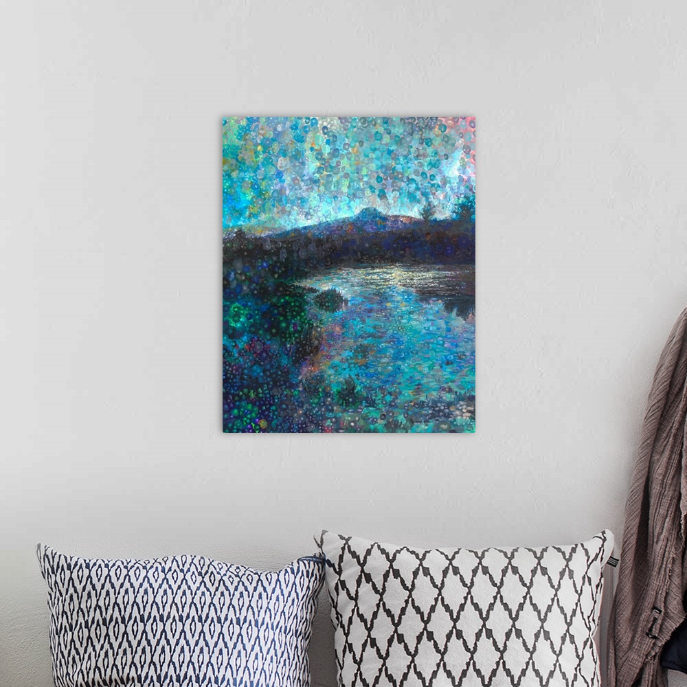 A bohemian room featuring Brightly colored contemporary artwork of a landscape of a mountian range with a lake.