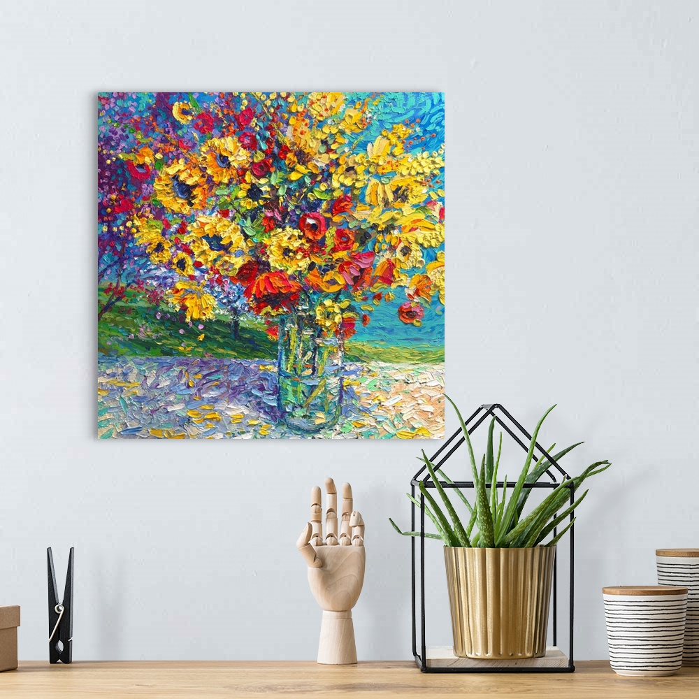 A bohemian room featuring Brightly colored contemporary artwork of a painting of red and yellow flowers in a vase.