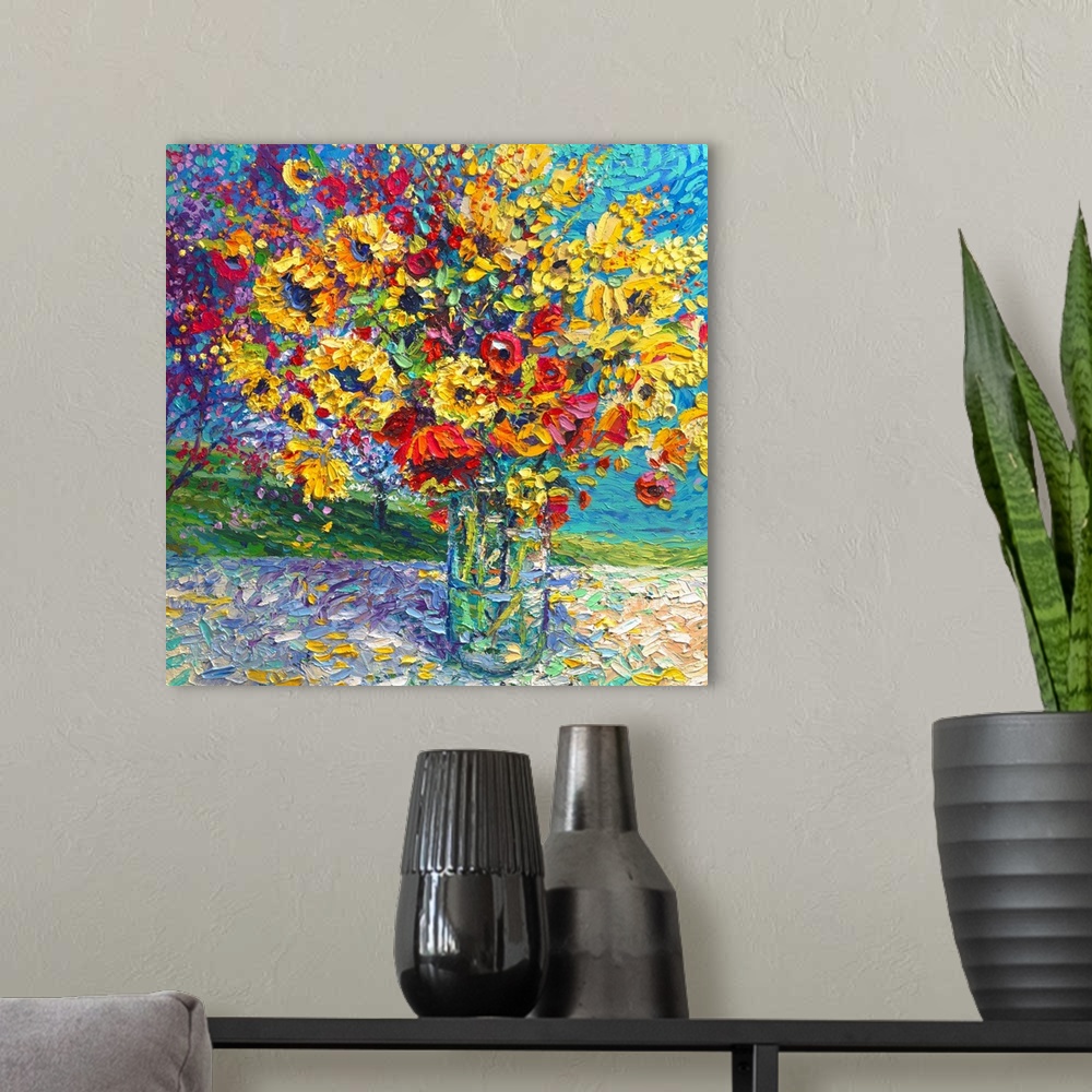 A modern room featuring Brightly colored contemporary artwork of a painting of red and yellow flowers in a vase.