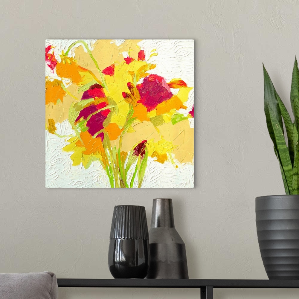 A modern room featuring Brightly colored contemporary artwork of a red, yellow, and orange flowers.