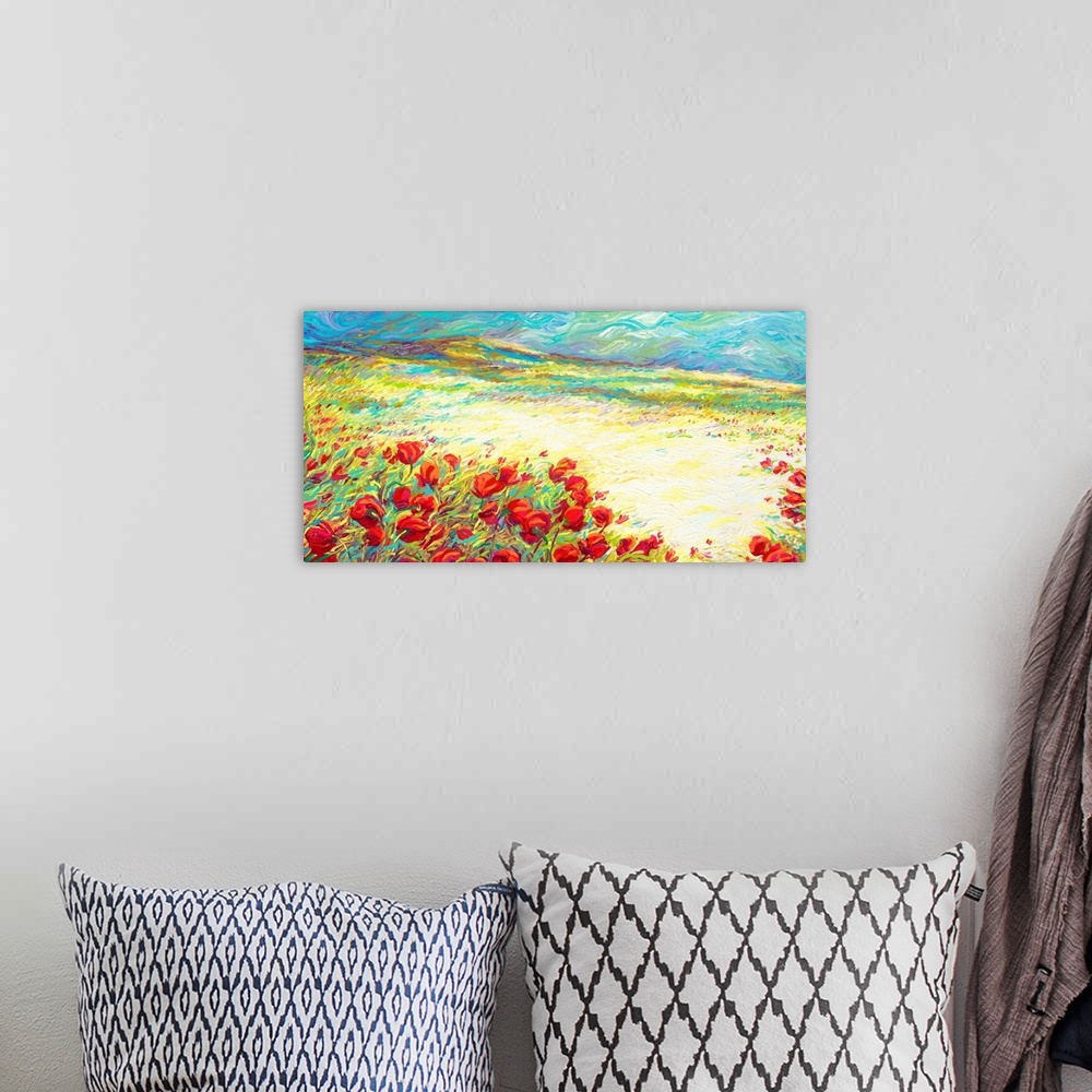 A bohemian room featuring Brightly colored contemporary artwork of a landscape of red flowers.