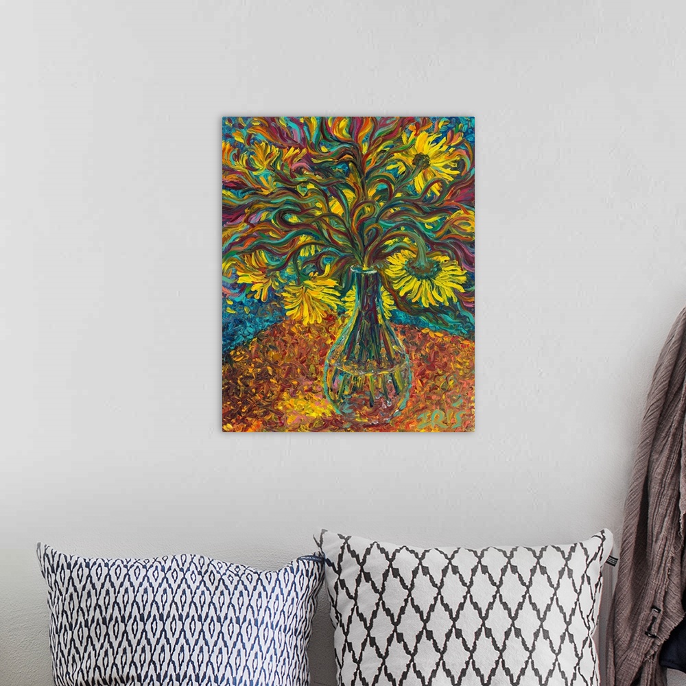 A bohemian room featuring Brightly colored contemporary artwork of yellow flowers in a vase.