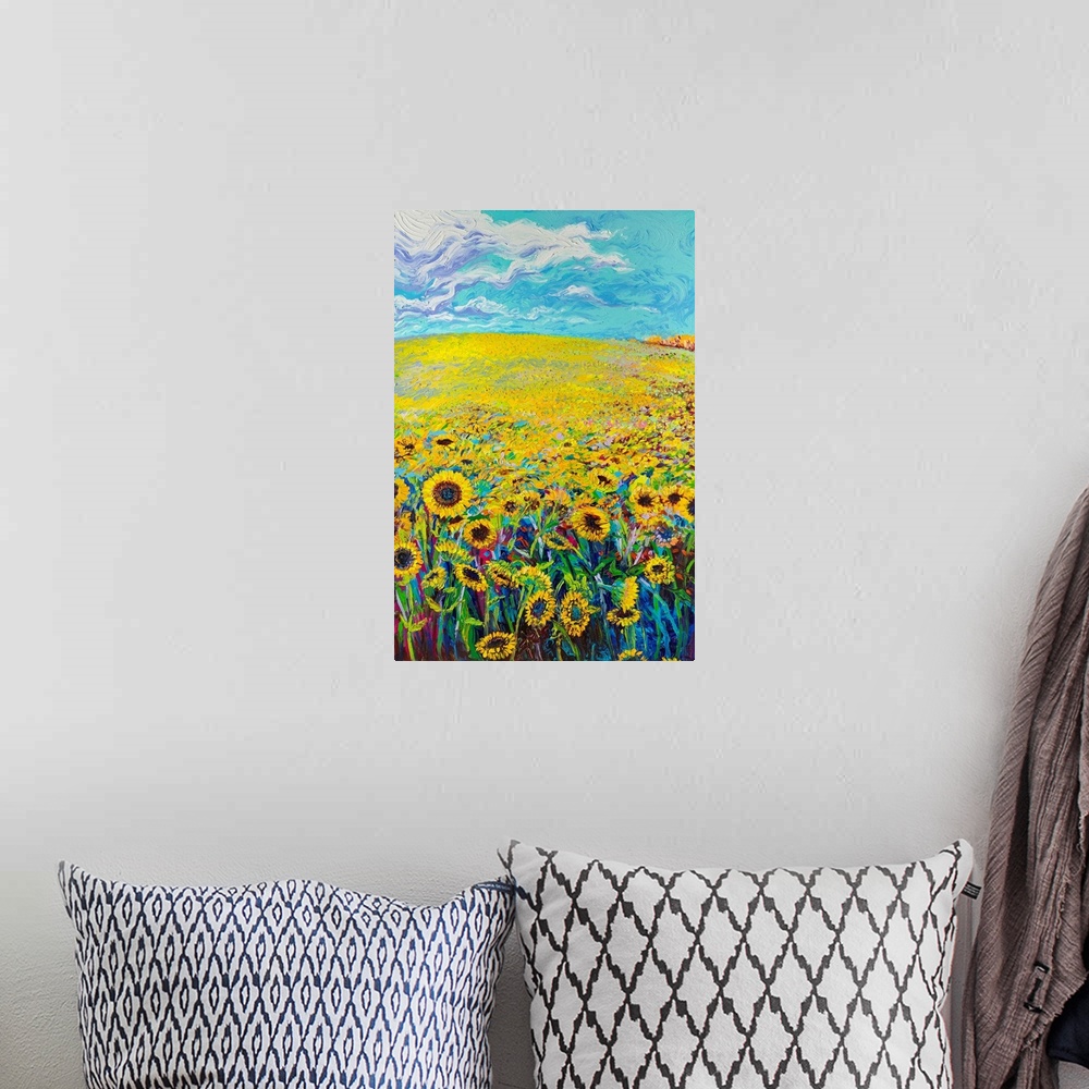 A bohemian room featuring Brightly colored triptych of a sunflower field. Panel 1 of 3.