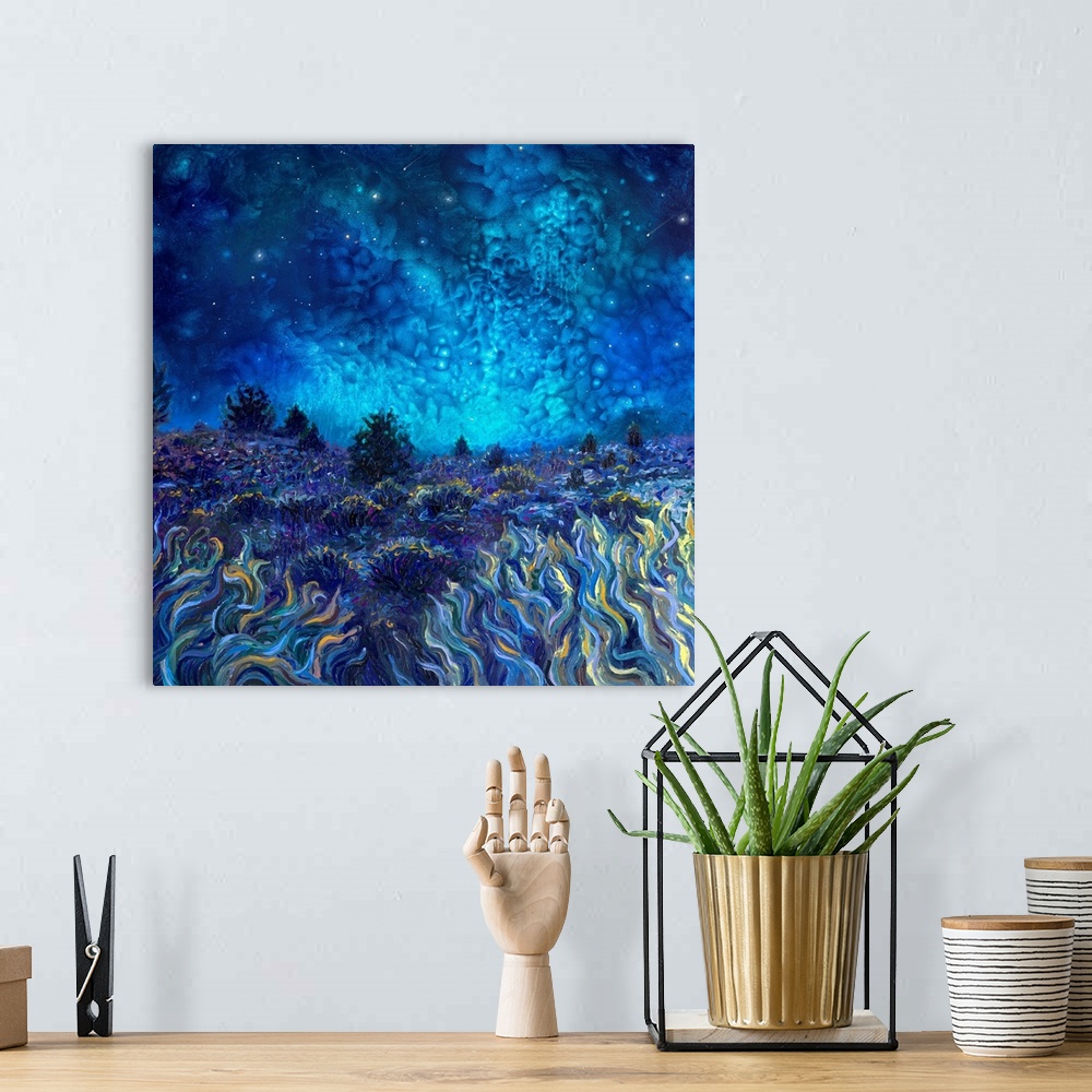 A bohemian room featuring Brightly colored contemporary artwork of a field at night.