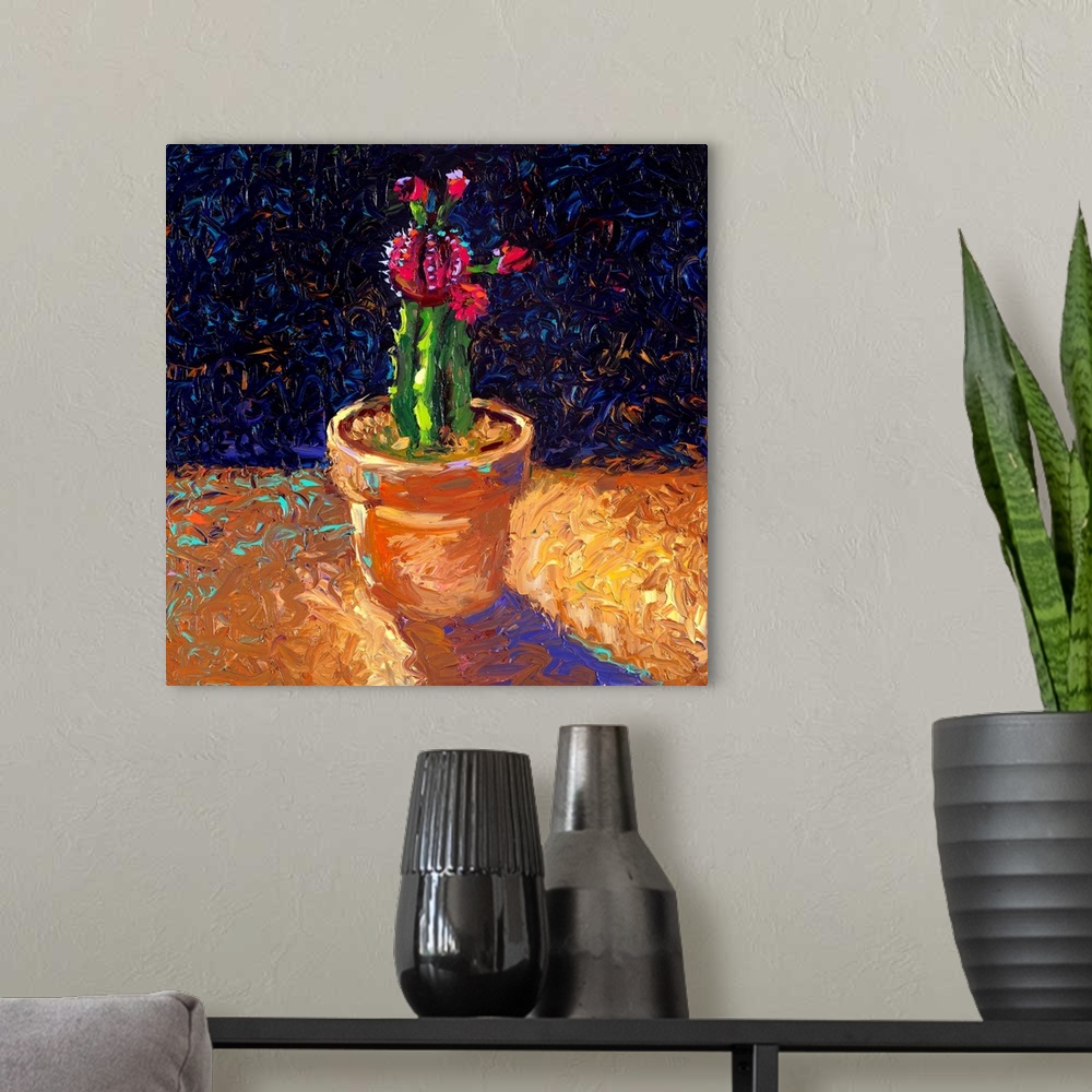 A modern room featuring Brightly colored contemporary artwork of a cactus in a pot.
