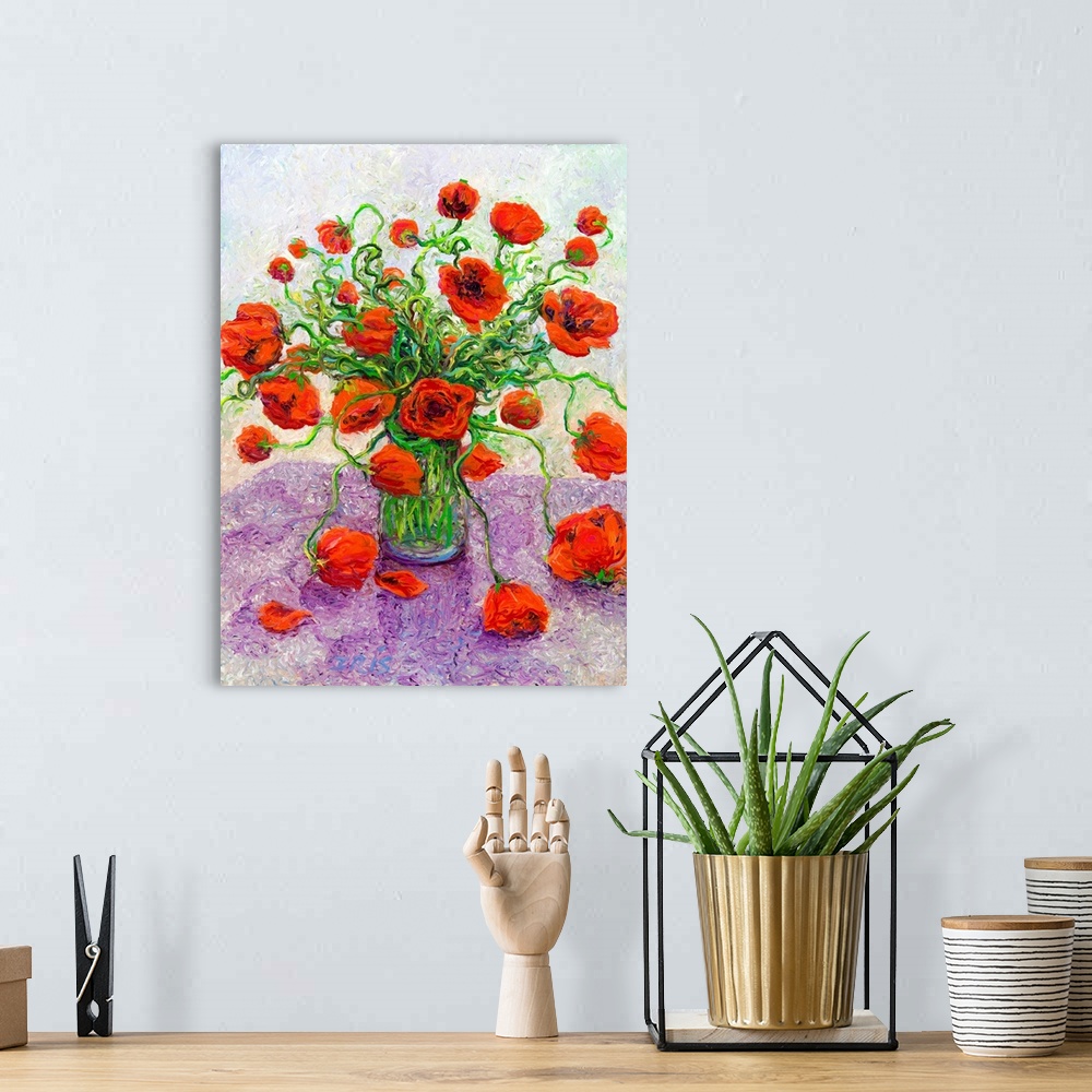 A bohemian room featuring Brightly colored contemporary artwork of red poppies in a vase.