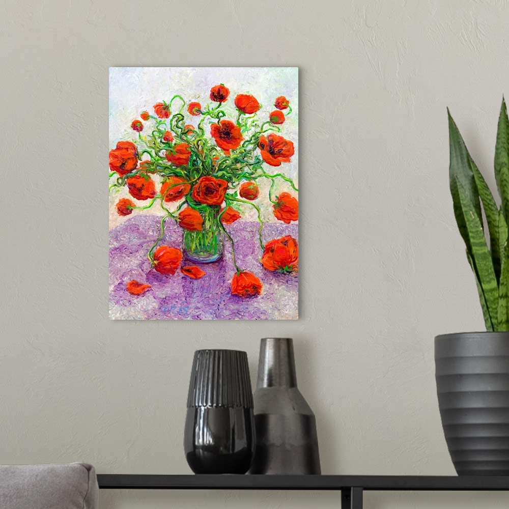A modern room featuring Brightly colored contemporary artwork of red poppies in a vase.