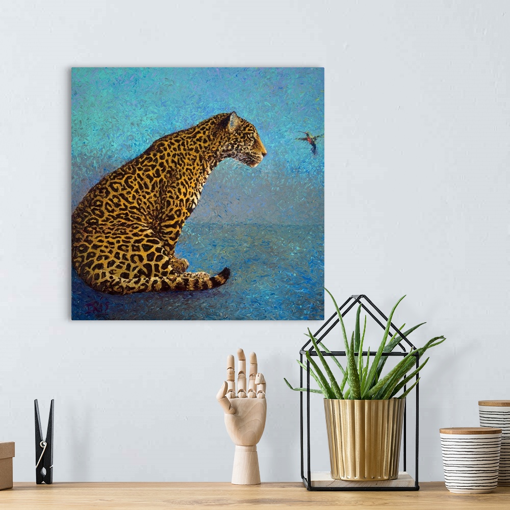 A bohemian room featuring Brightly colored contemporary artwork of a leopard and a hummingbird.