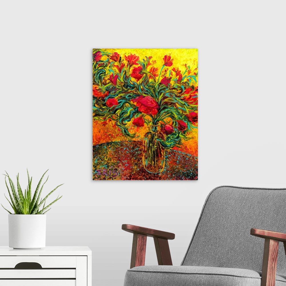 A modern room featuring Brightly colored contemporary artwork of red flowers in a vase.