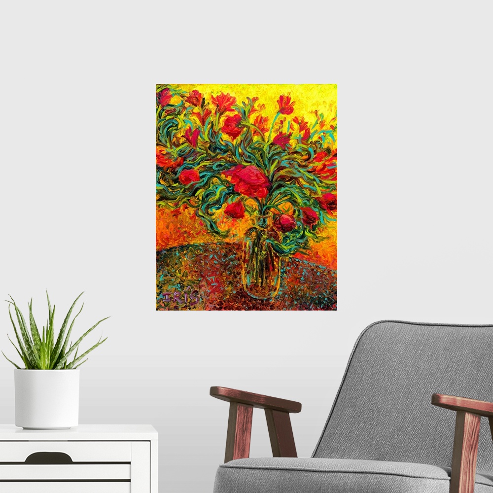 A modern room featuring Brightly colored contemporary artwork of red flowers in a vase.