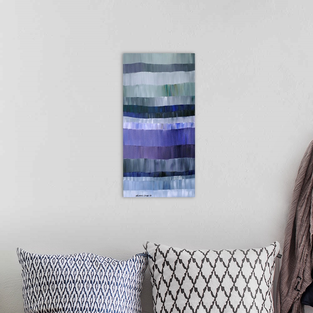 A bohemian room featuring Abstract painting of horizontal layers in varying shades of grey and blue.