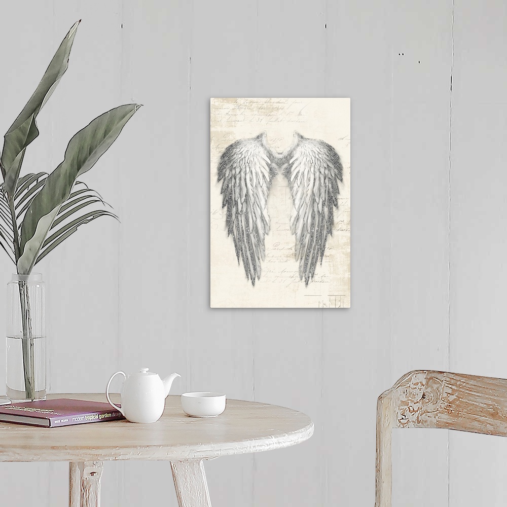 A farmhouse room featuring A vertical drawing of a pain of angel wings with metallic sliver accents on a neutral backdrop wi...