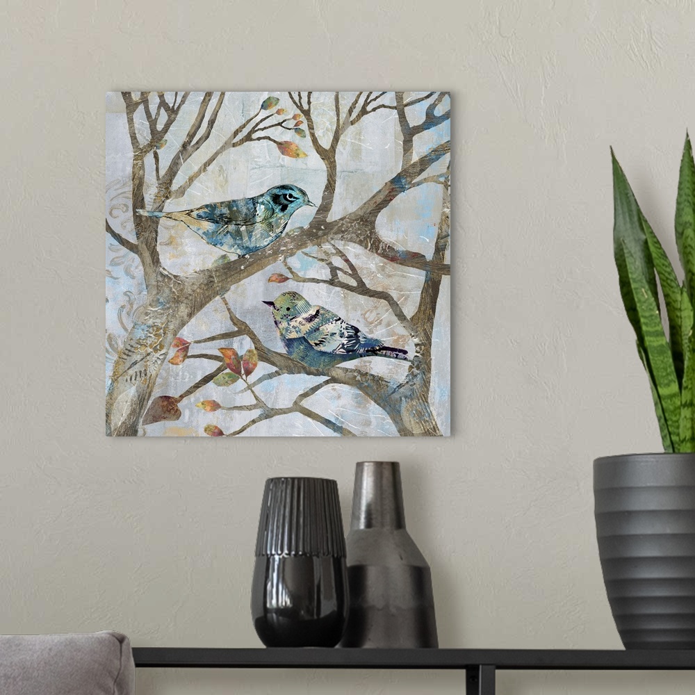 A modern room featuring A mixed media painting of two birds perched on tree limbs with hints of printed text and gold acc...