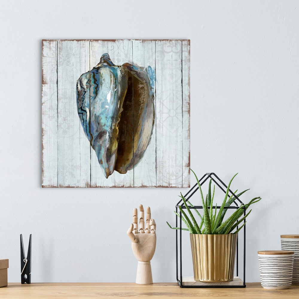 A bohemian room featuring A decorative image of a blue shaded shell on a white wood background with faded floral designs.