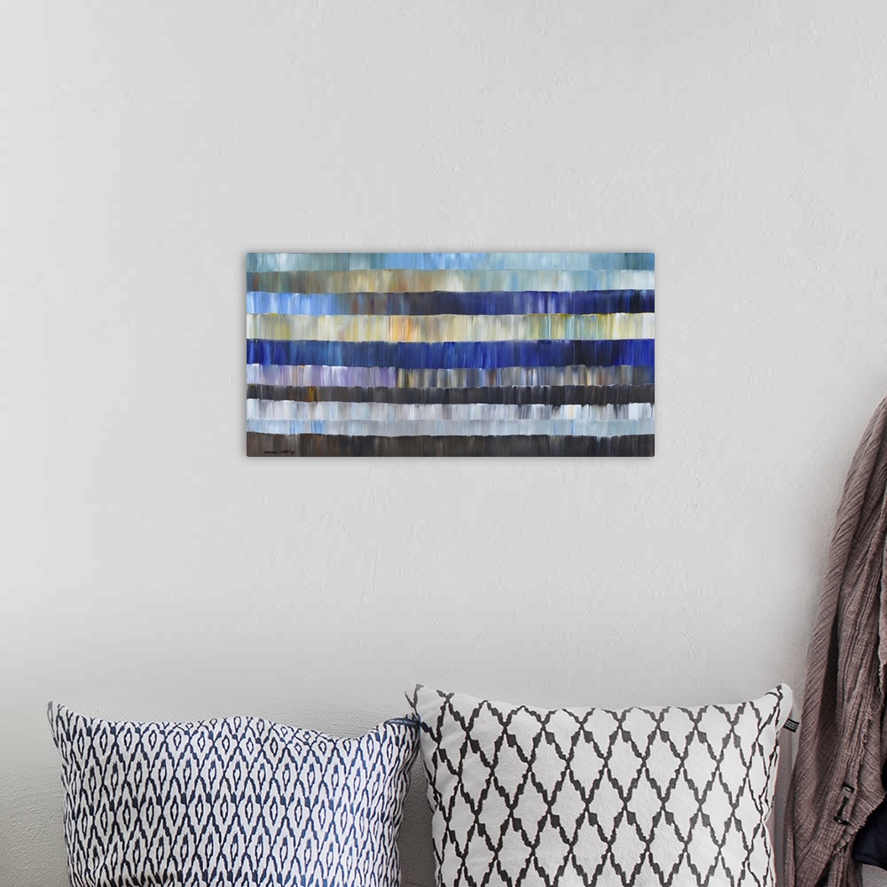A bohemian room featuring Abstract artwork of layers in different shades of blue.