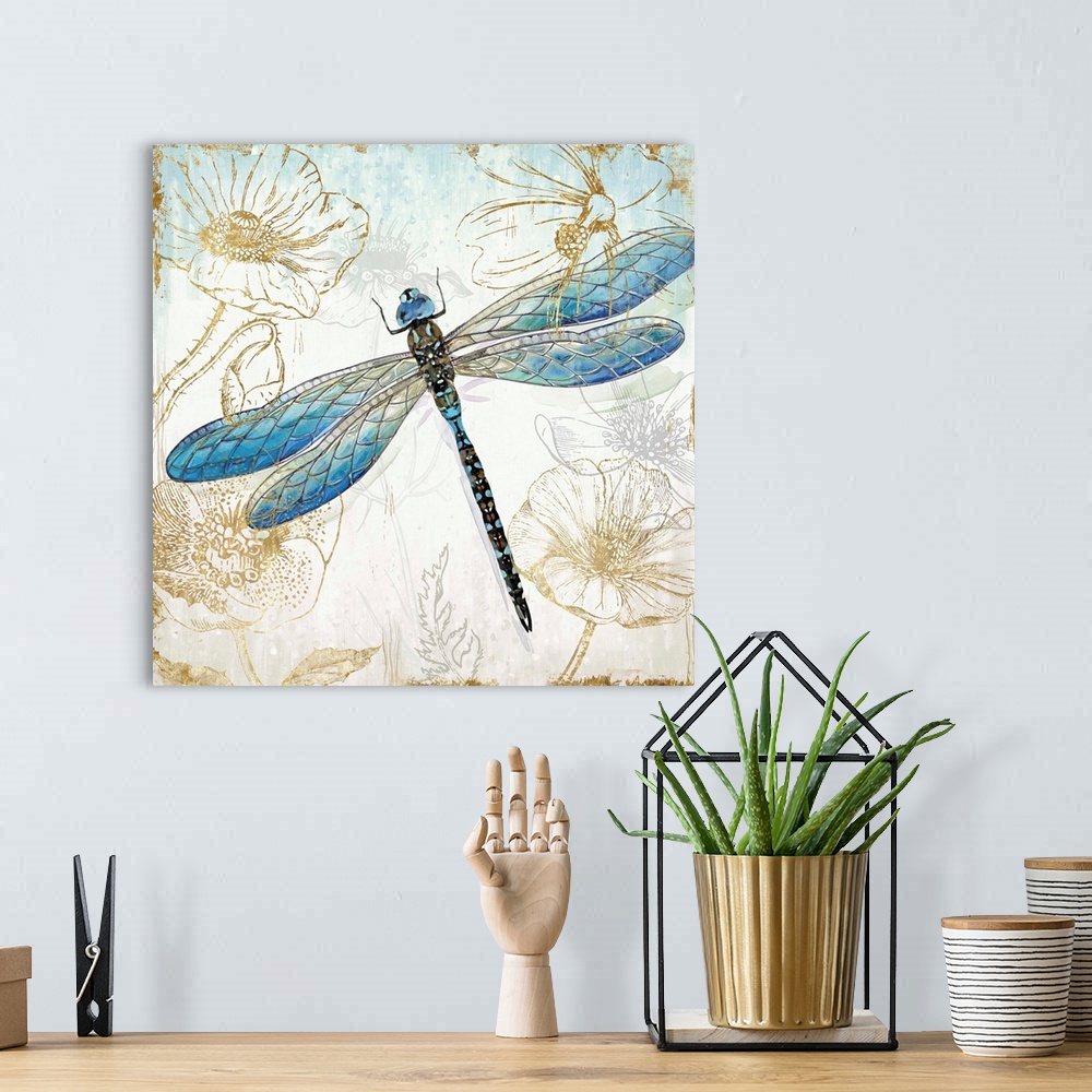 A bohemian room featuring A decorative watercolor dragonfly in shades of blue and green on a floral metallic gold design.