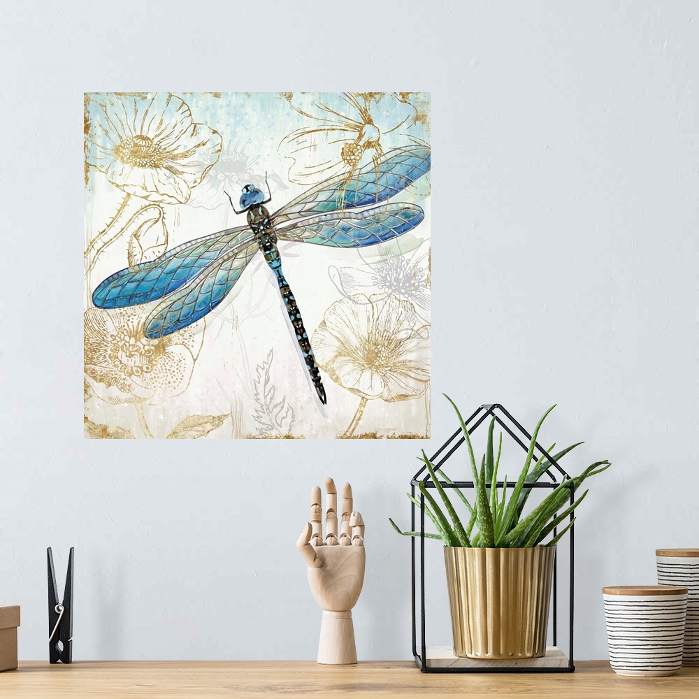 A bohemian room featuring A decorative watercolor dragonfly in shades of blue and green on a floral metallic gold design.