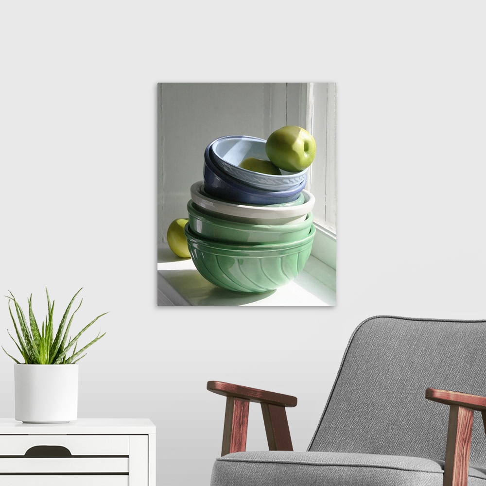 A modern room featuring A stack of ceramic bowls with green apples on a windowsill.