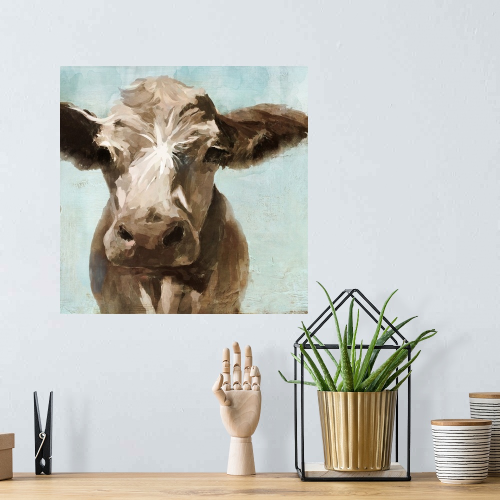 A bohemian room featuring A contemporary painting of a brown cow on a pale blue background.