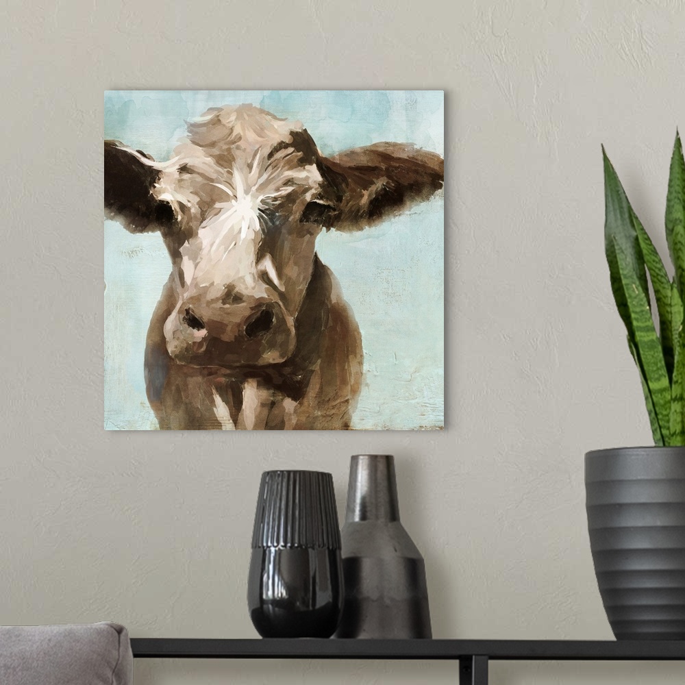 A modern room featuring A contemporary painting of a brown cow on a pale blue background.