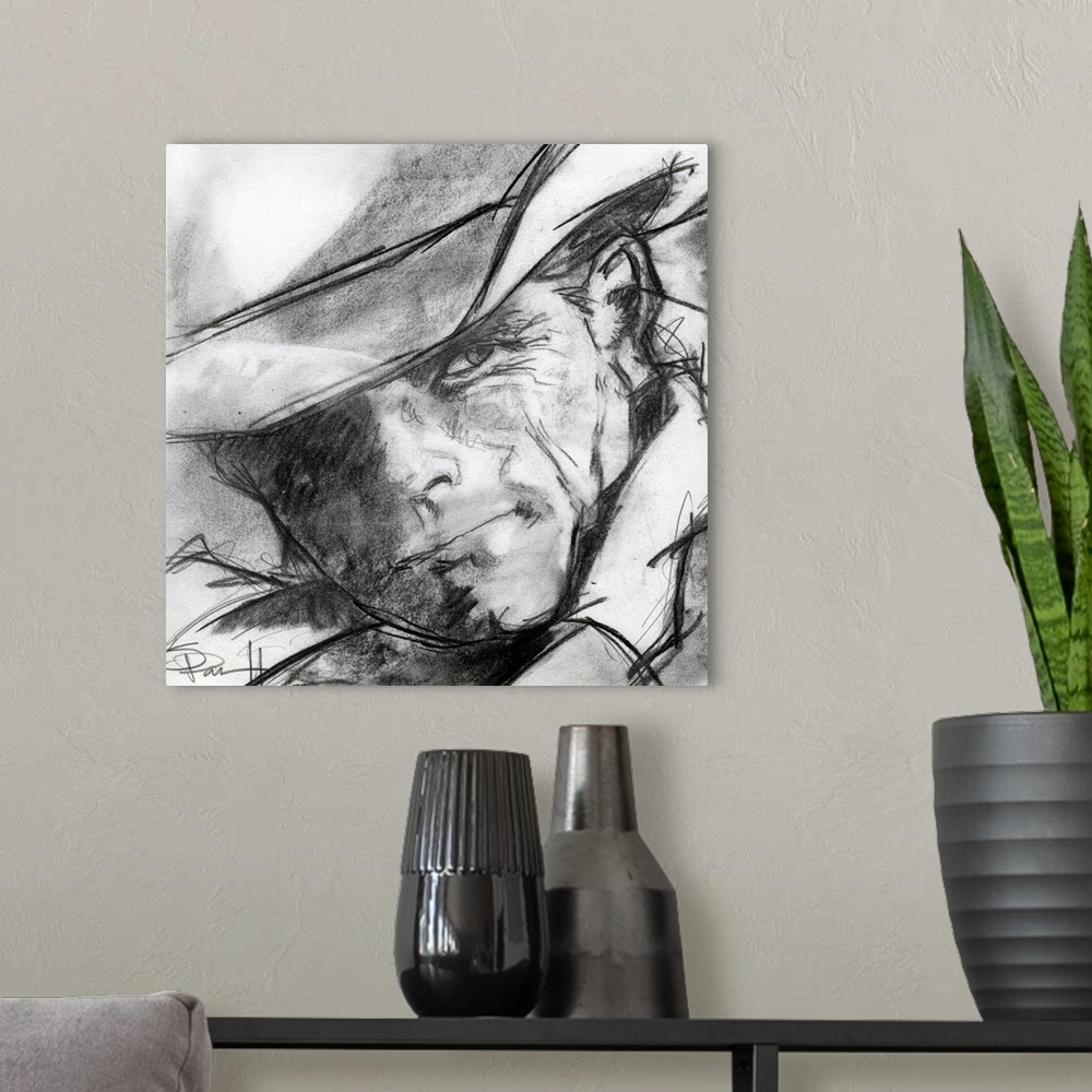 A modern room featuring Black and white sketch of a cowboy's face.