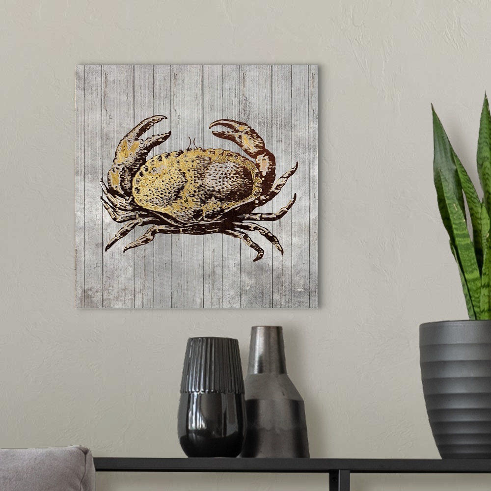 A modern room featuring A decorative image of a crab with gold accents on a gray wood backdrop.