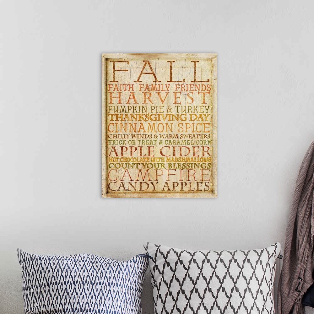 A bohemian room featuring Weathered typography artwork with autumn-themed phrases.