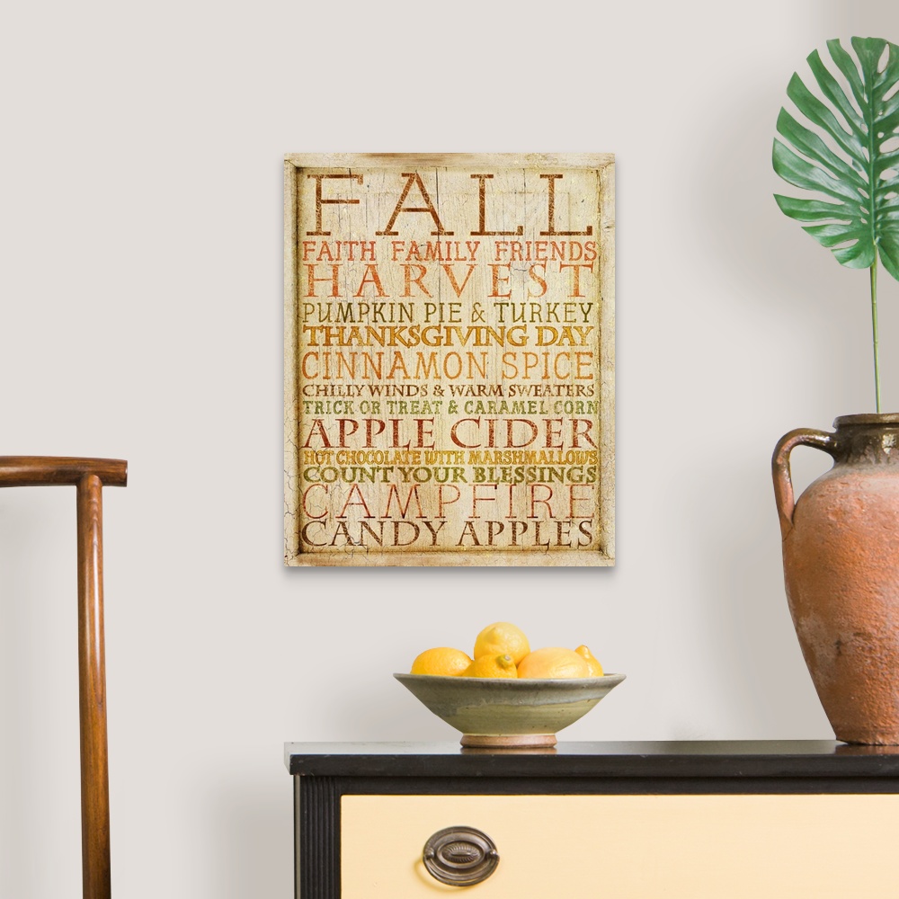 A traditional room featuring Weathered typography artwork with autumn-themed phrases.