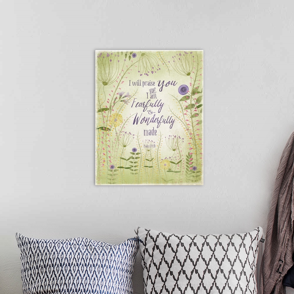 A bohemian room featuring Bible verse illustrated with green and lavender flowers.