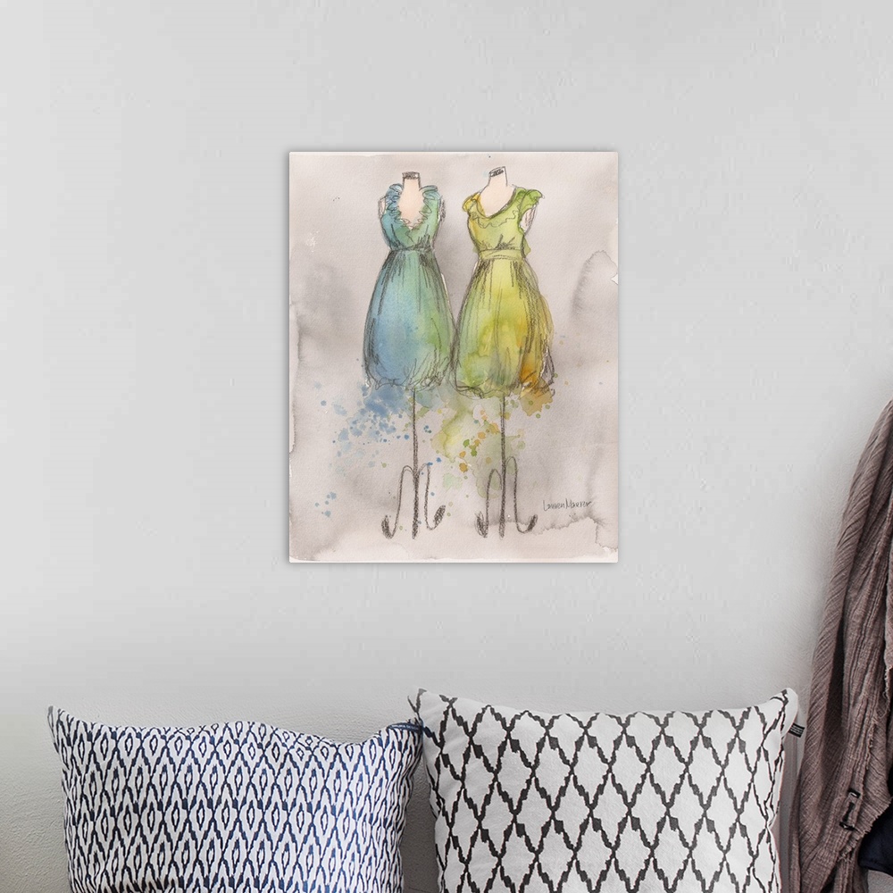 A bohemian room featuring Watercolor painting of blue and yellow dresses on dress forms.