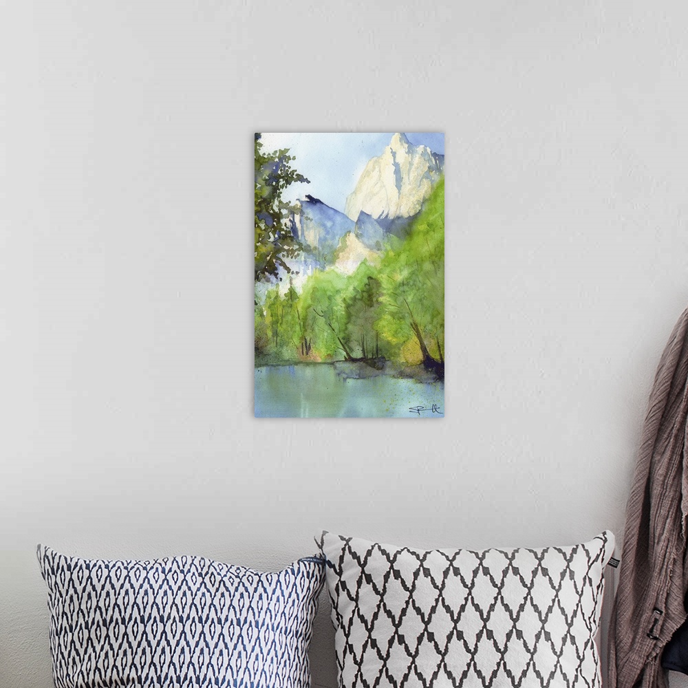 A bohemian room featuring Landscape painting of a river in a forest with tall mountains.