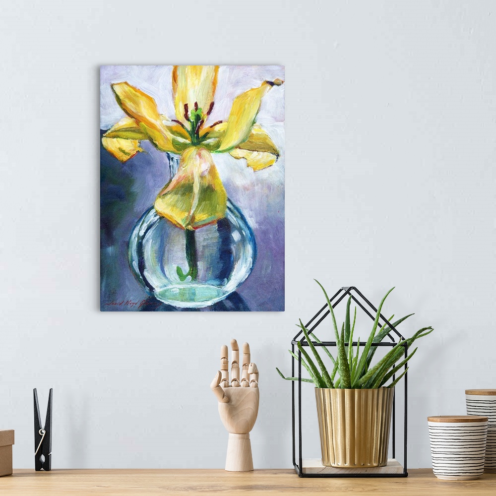 A bohemian room featuring Cut lily flower in glass vase still life.