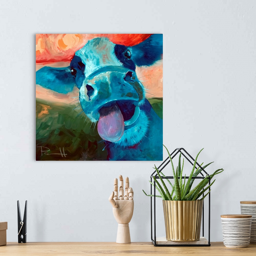 A bohemian room featuring Portrait of a blue cow sticking out its tongue.
