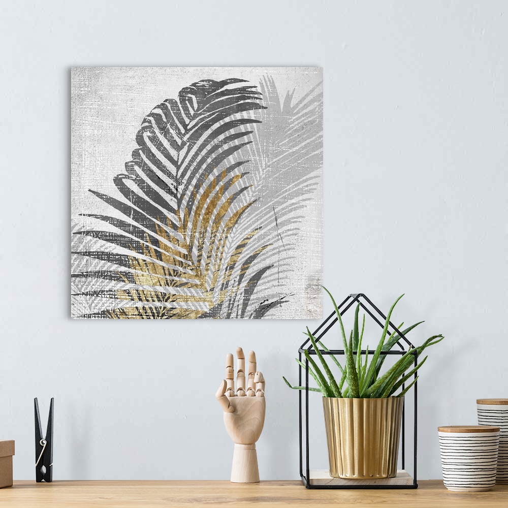 A bohemian room featuring A square artistic image of a gold and gray fern leaves with a fade leaf in the background with wh...