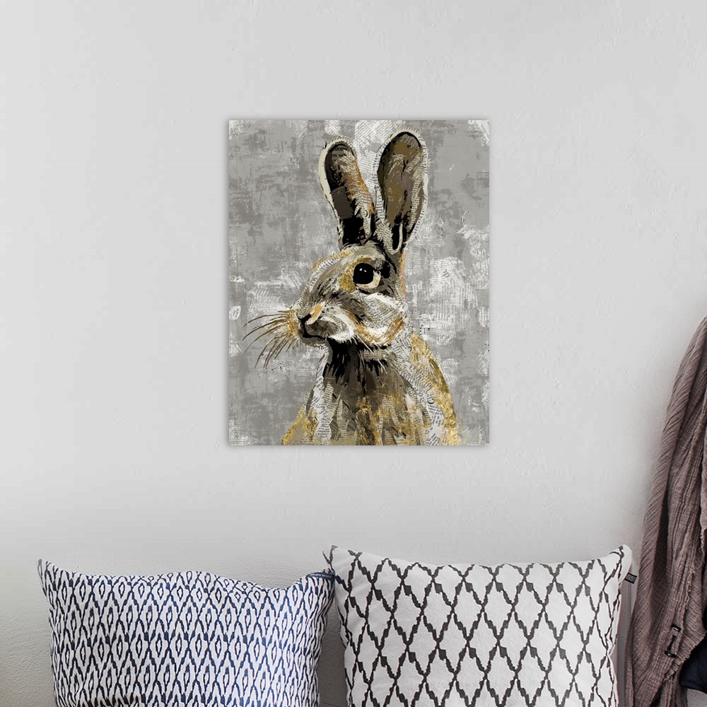 A bohemian room featuring A decorative image of a rabbit with gold accents on a gray backdrop with faded newspaper peeping ...