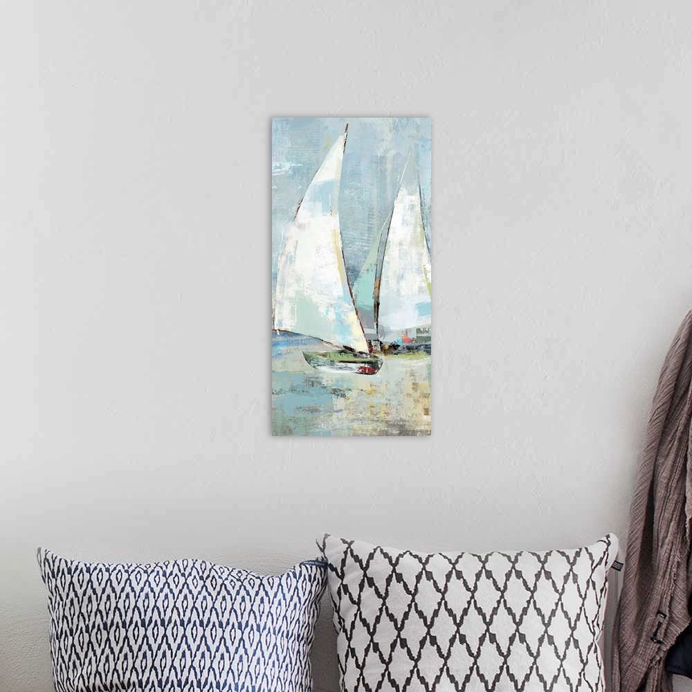 A bohemian room featuring A long vertical painting of sailboats with patches of multiple colors in muted tones.