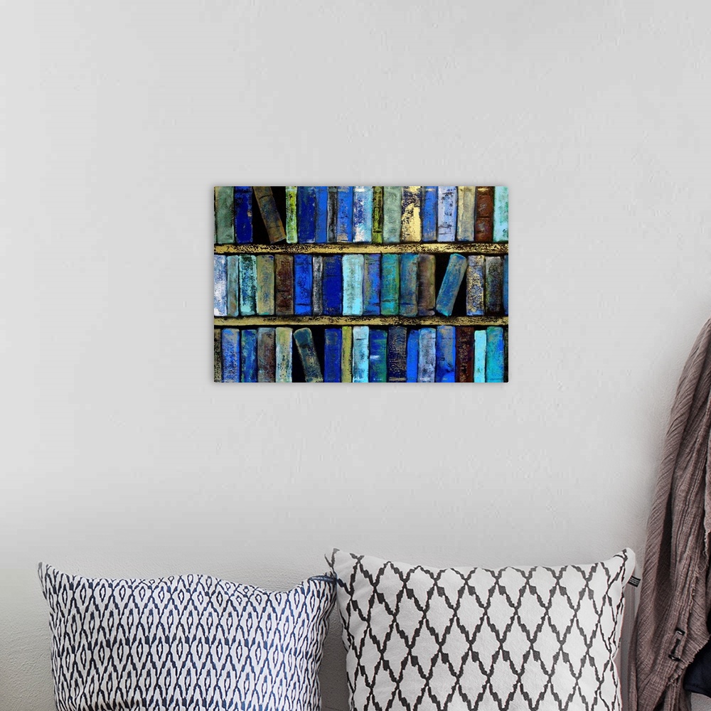 A bohemian room featuring Three shelves of books in varying shades of blue.