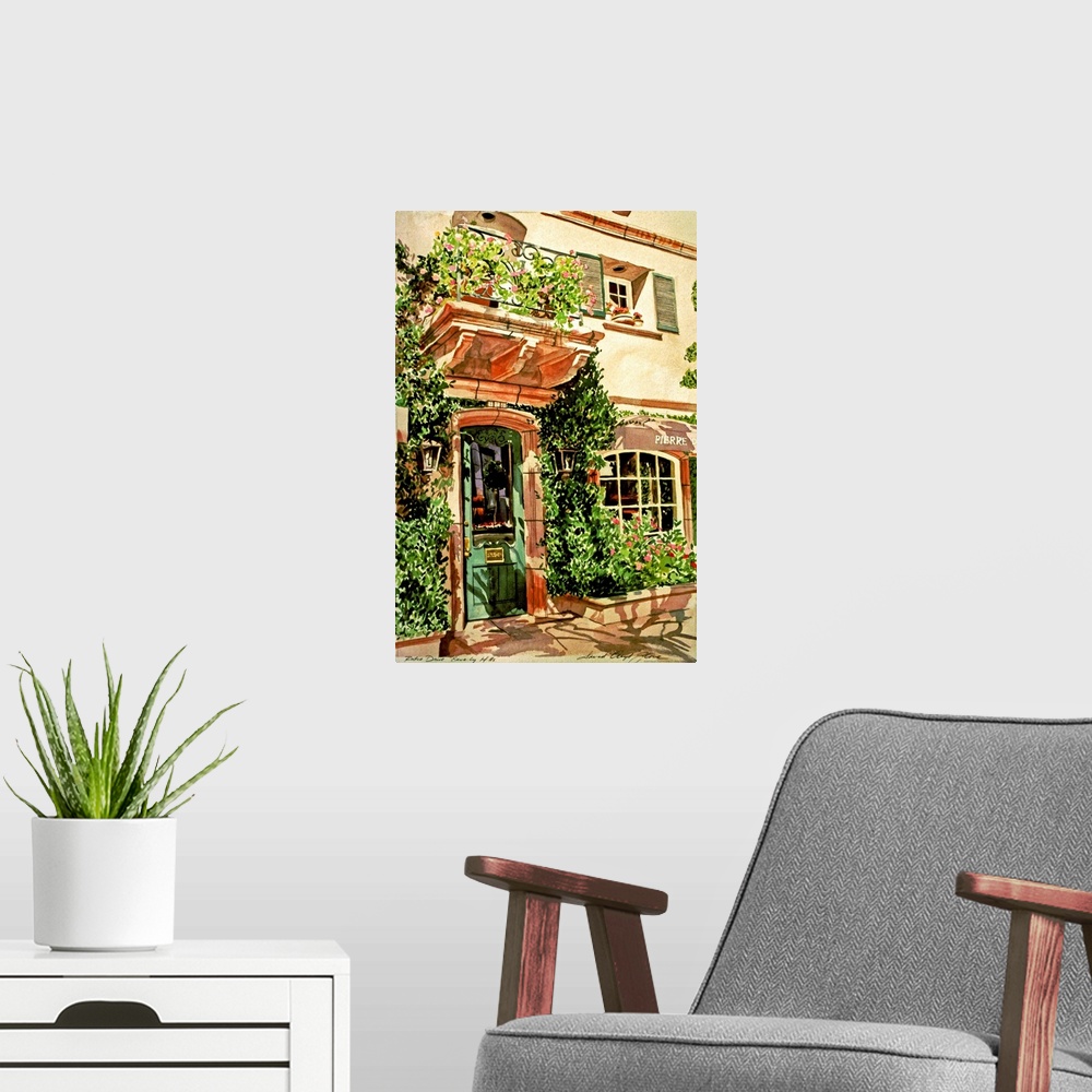 A modern room featuring Watercolor painting of a doorway and window covered in vines in a European village.