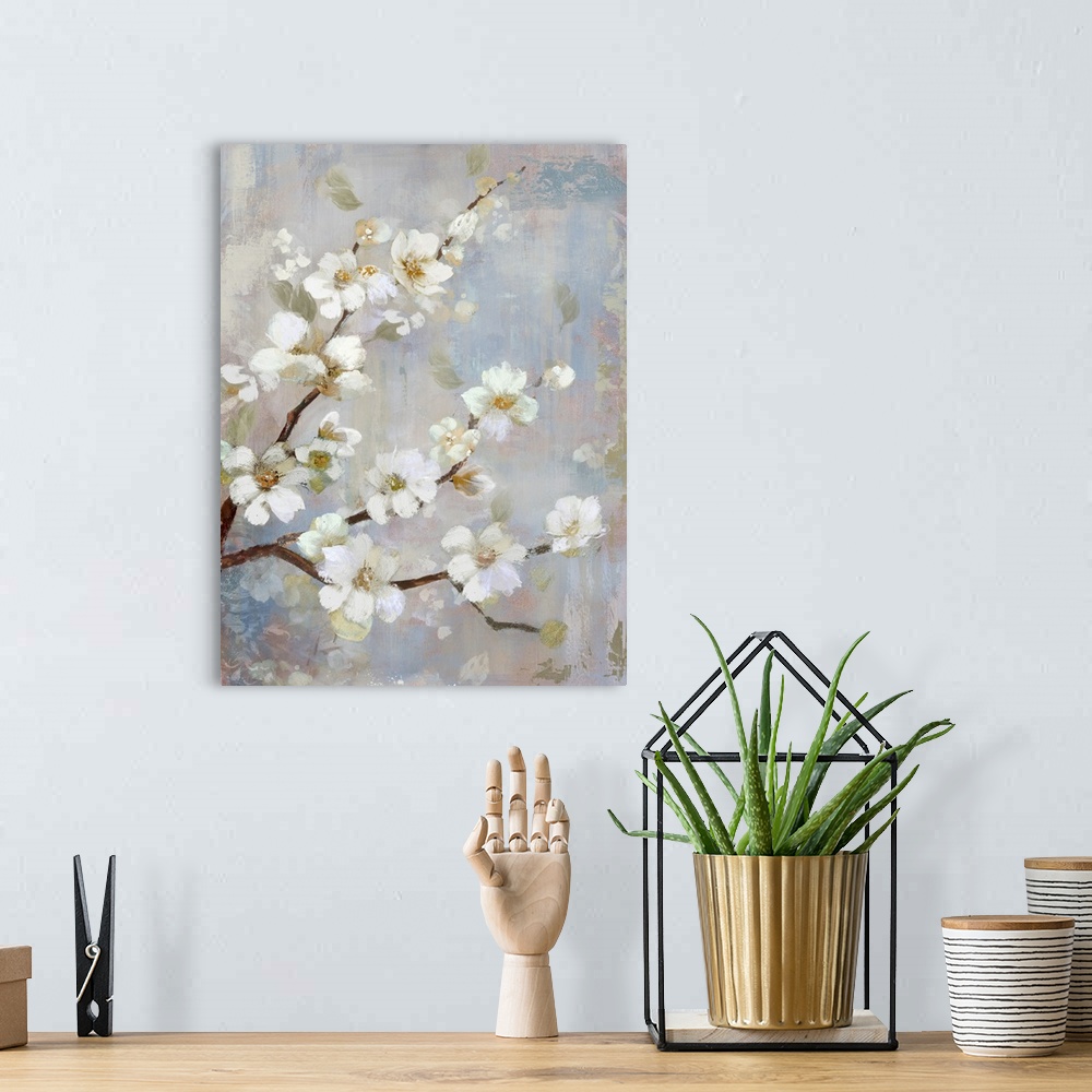 A bohemian room featuring A contemporary vertical painting of a branch of white cherry blossoms against a neutral backdrop.