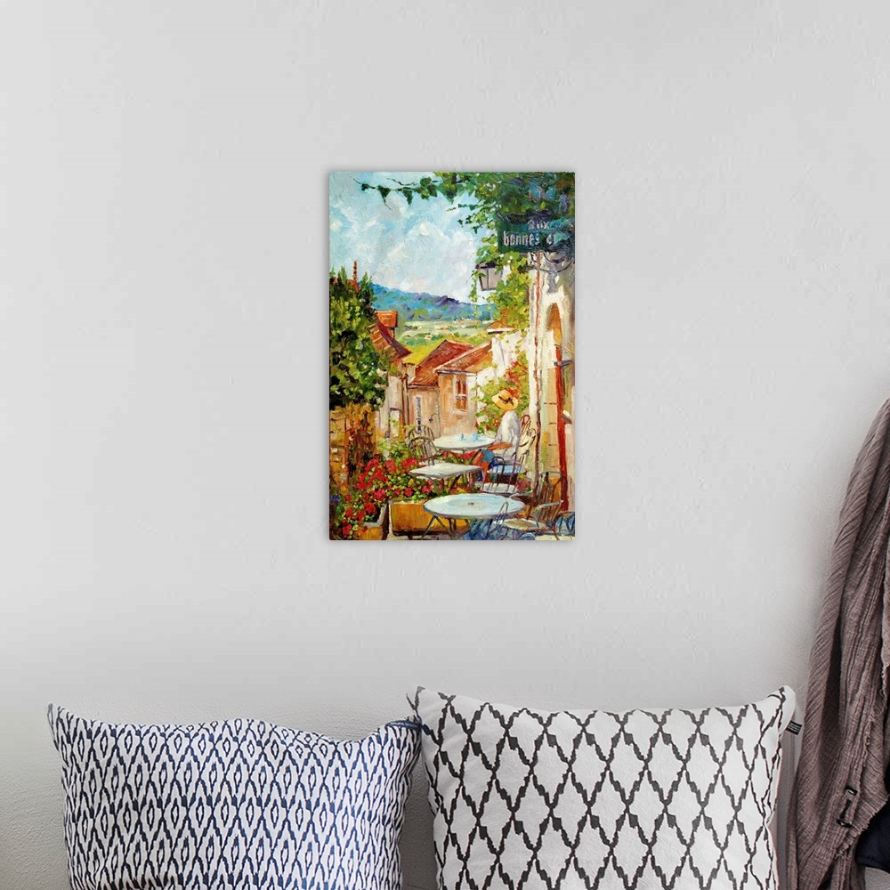 A bohemian room featuring Artwork of a person sitting at an outdoor cafe in the morning in France.