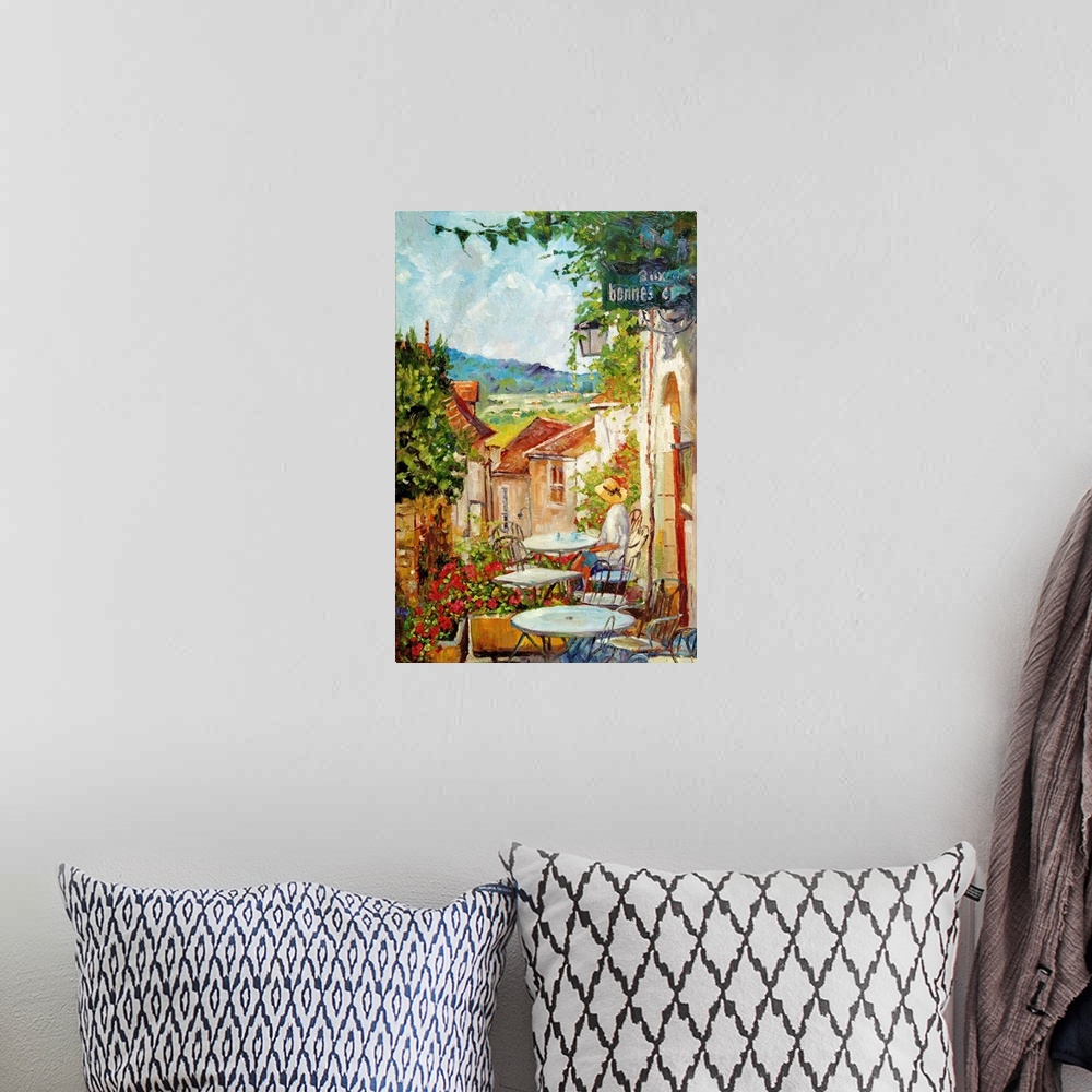 A bohemian room featuring Artwork of a person sitting at an outdoor cafe in the morning in France.