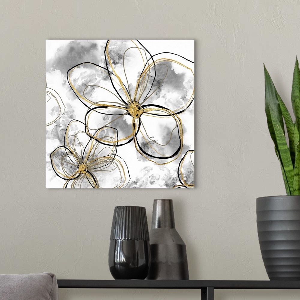 A modern room featuring Decorative artwork of outlined flowers in black and gold with gray blurred spots on a white backg...