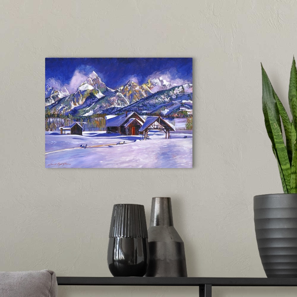A modern room featuring Painting of a cabin near a mountain range in a snowy landscape.